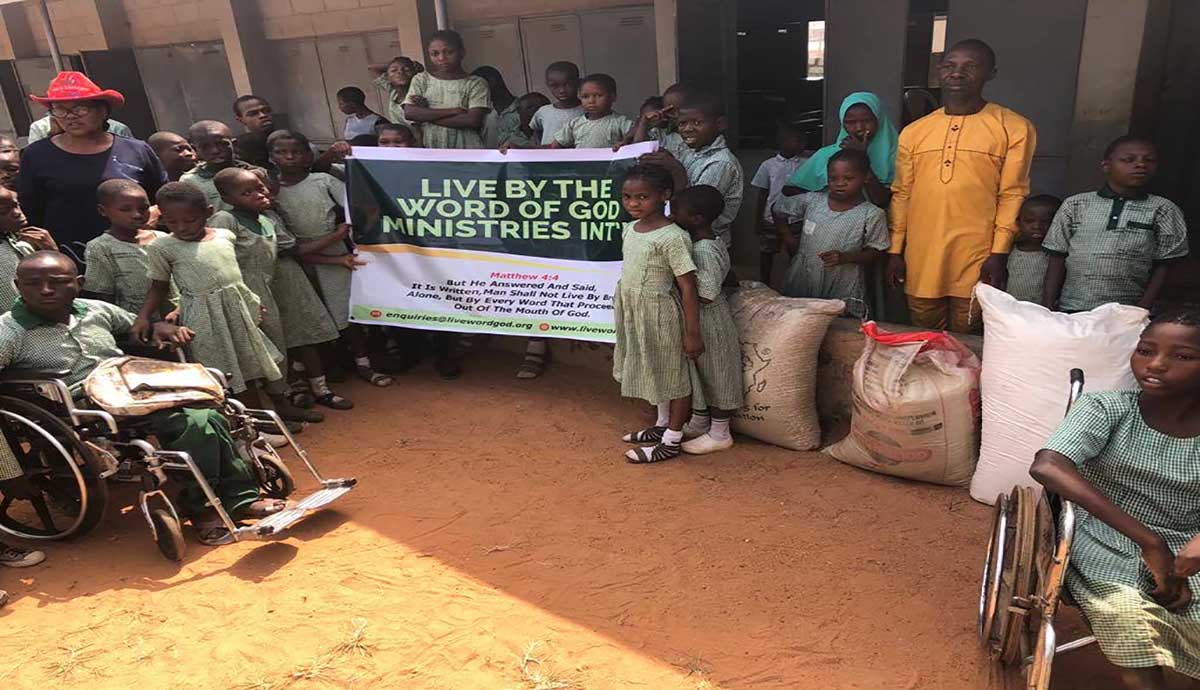 Image of Mr Ojo and kids from CAC School for the Handicapped Ibadan School 